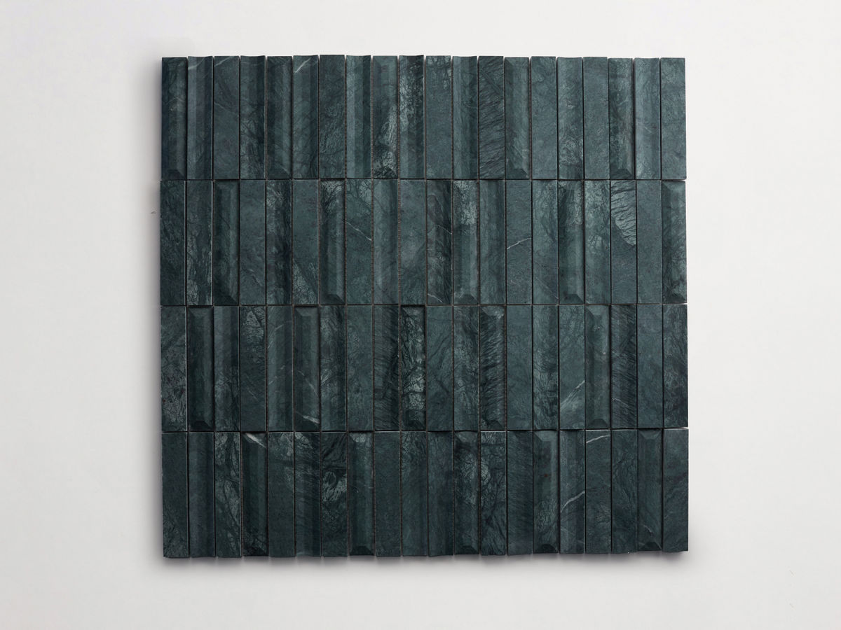 A square grid of vertical, rectangular, dark green marble tiles with visible veins, mounted on a white background.