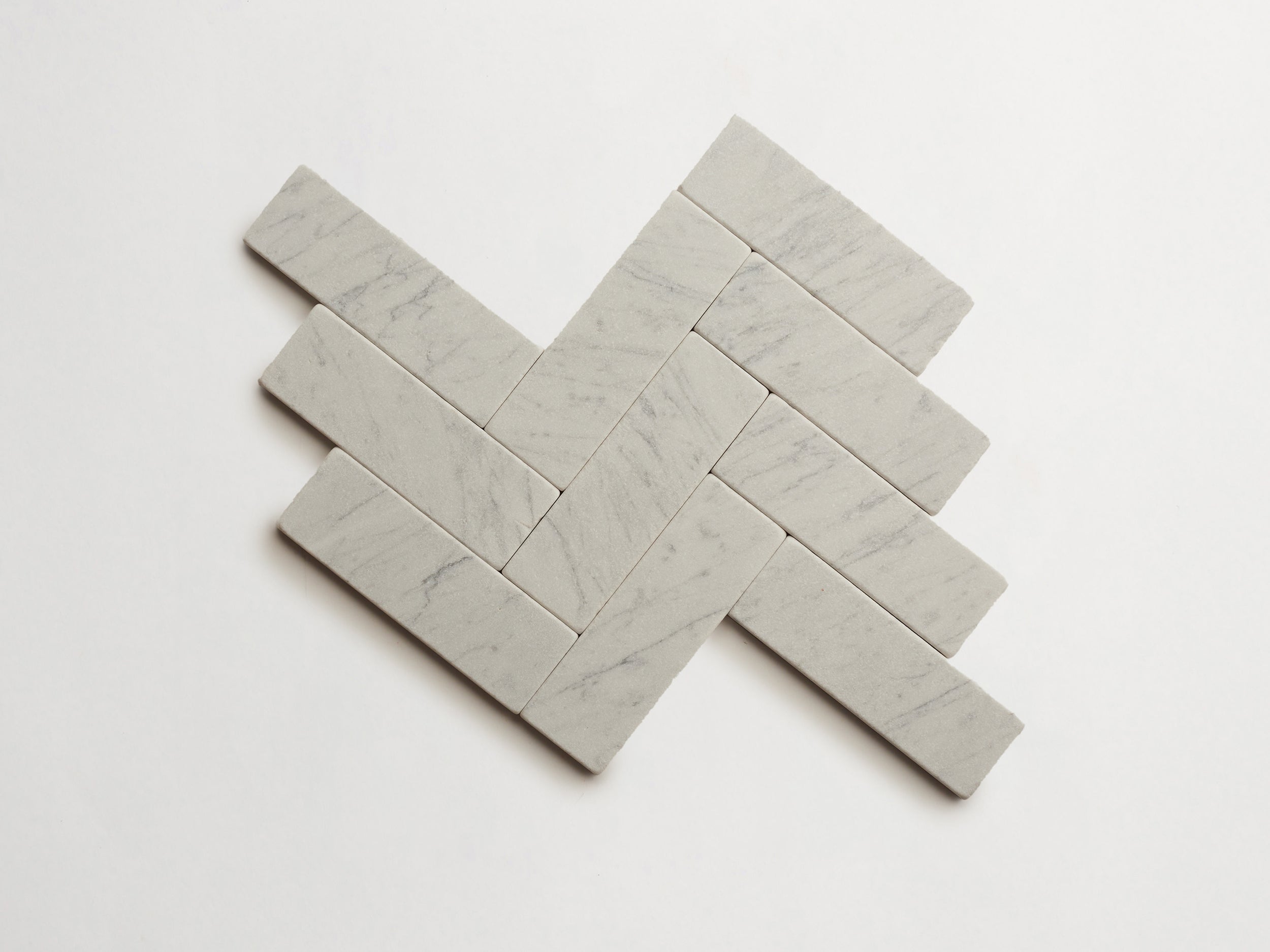 cle-tile-stone-tumbled-lapidary-carrara-baguette-herringbone-3000x3000-300dpi.jpg