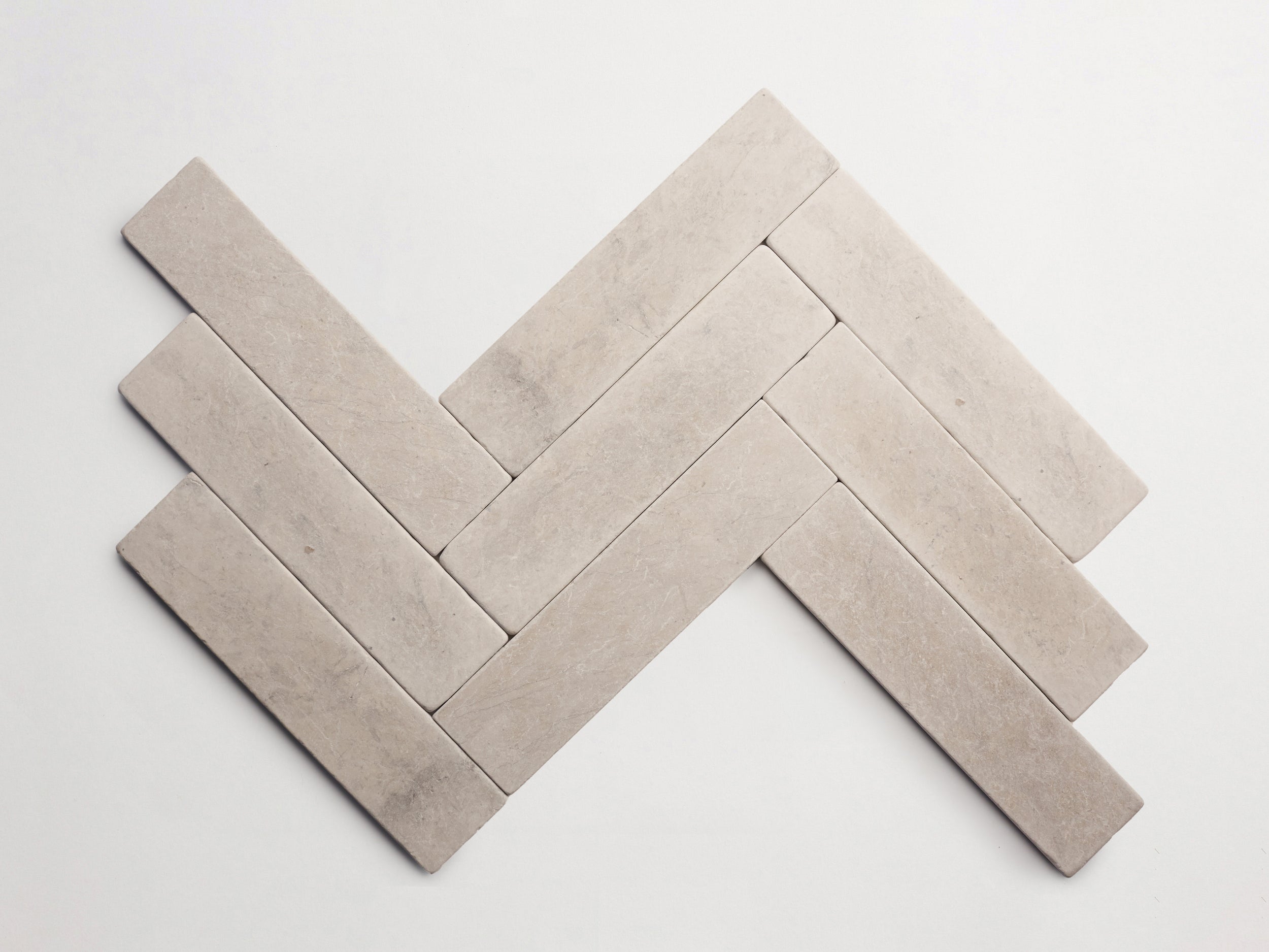 cle-tile-stone-tumbled-lapidary-blade-herringbone-alpaca-grey-3000x2250-300dpi.jpg