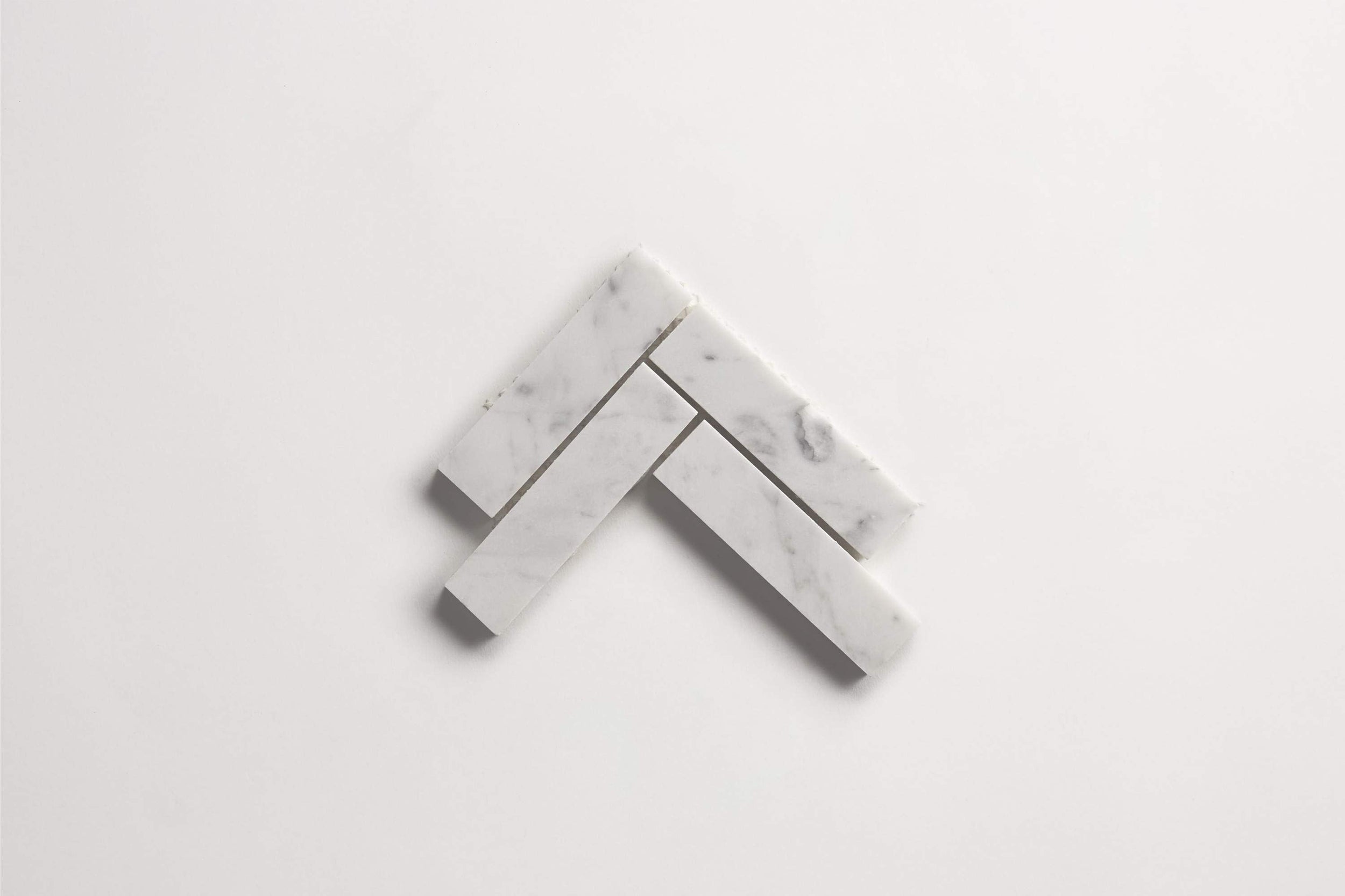cle-tile-stone-carrara-herringbone-multi-small.jpg