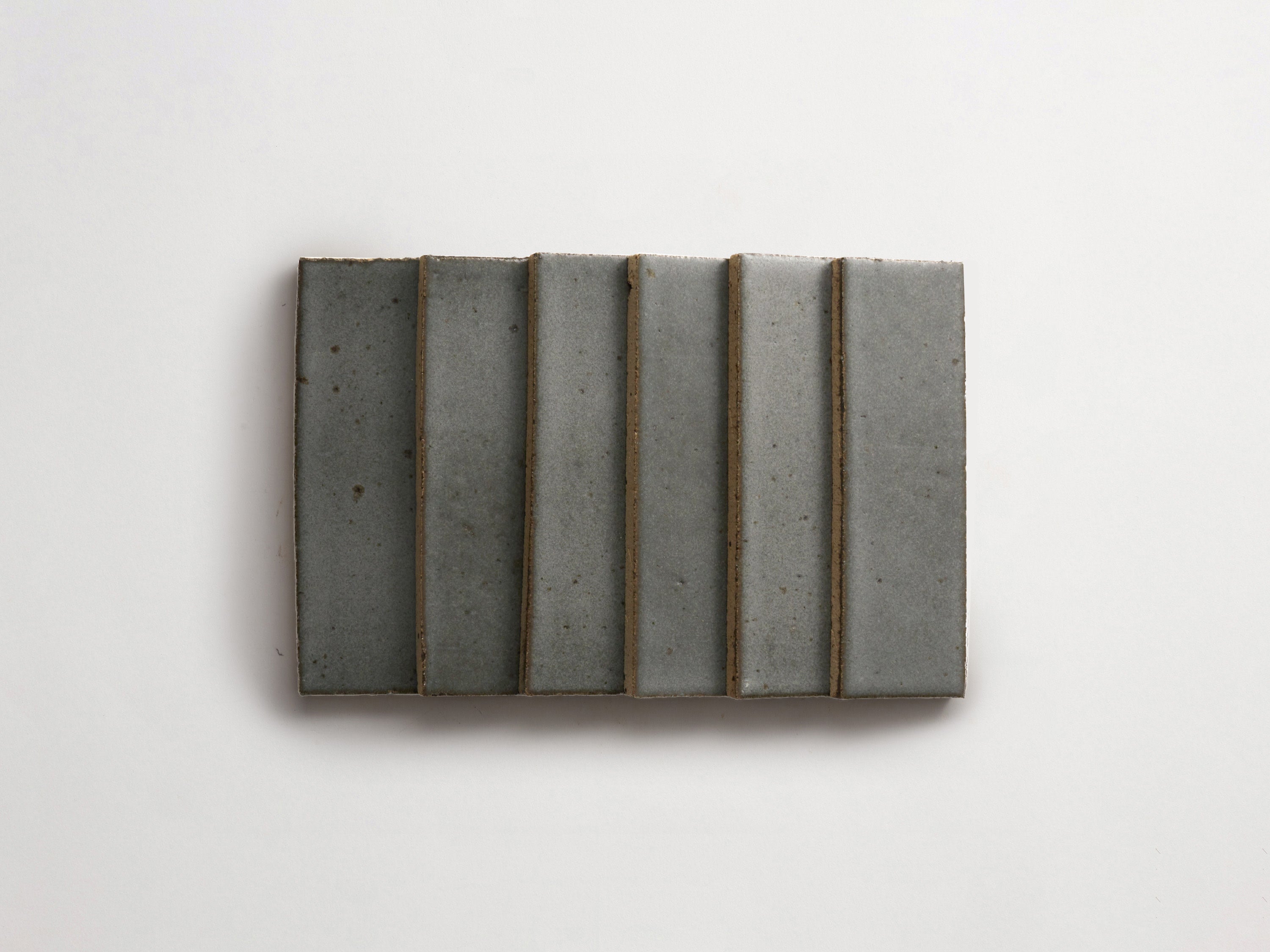 clé guild | thin glazed brick | black wool | 8 x 2.5 x 0.5