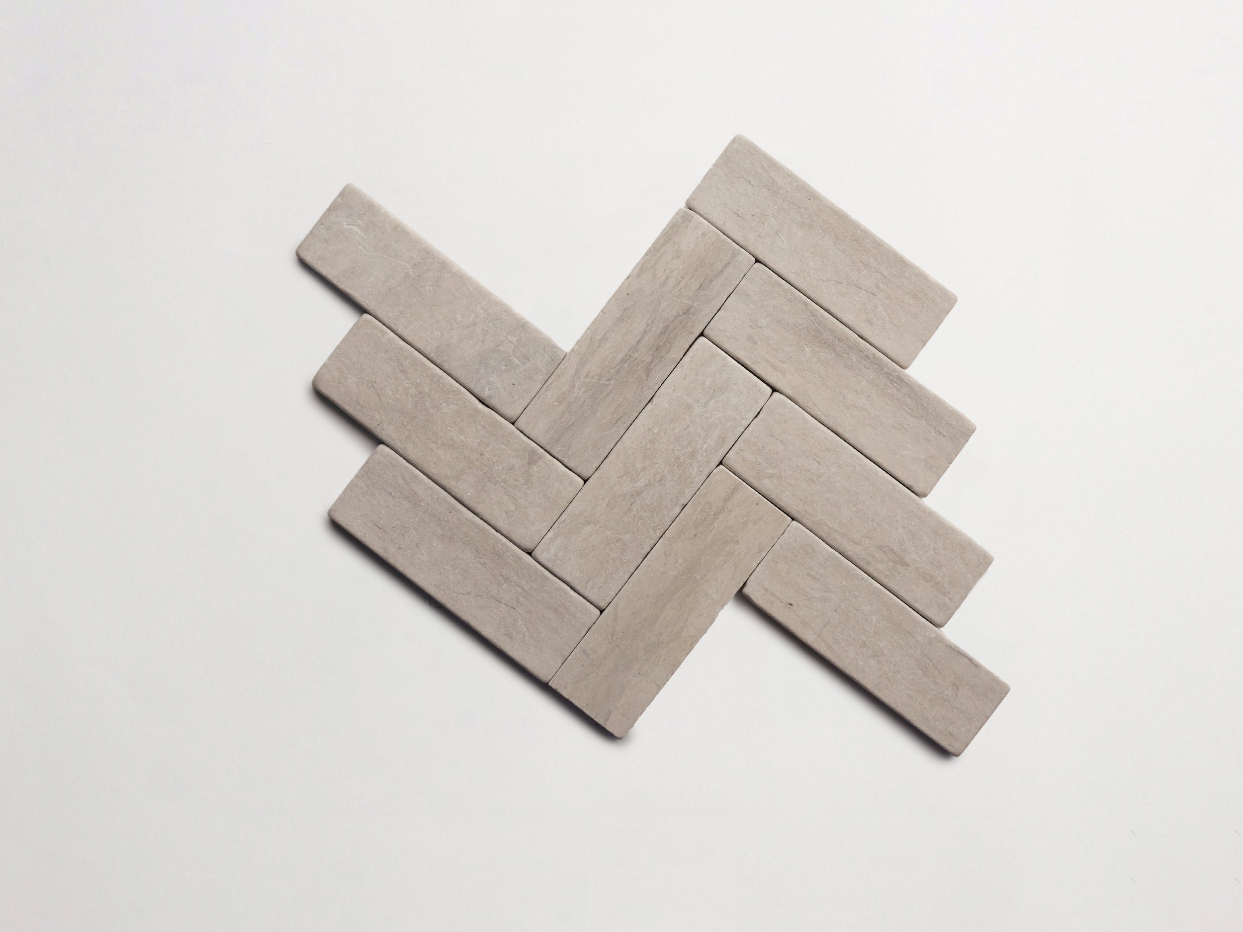 cle-tile-stone-tumbled-lapidary-baguette-herringbone-alpaca-grey-3000x2250-300dpi.jpg