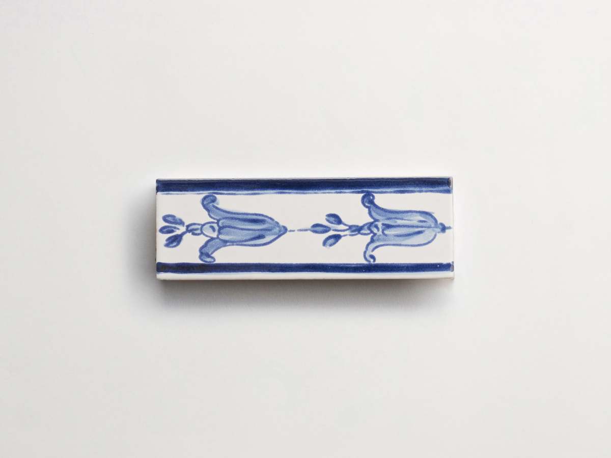 Hand painted blue tile flowers rectangle delft backsplash.