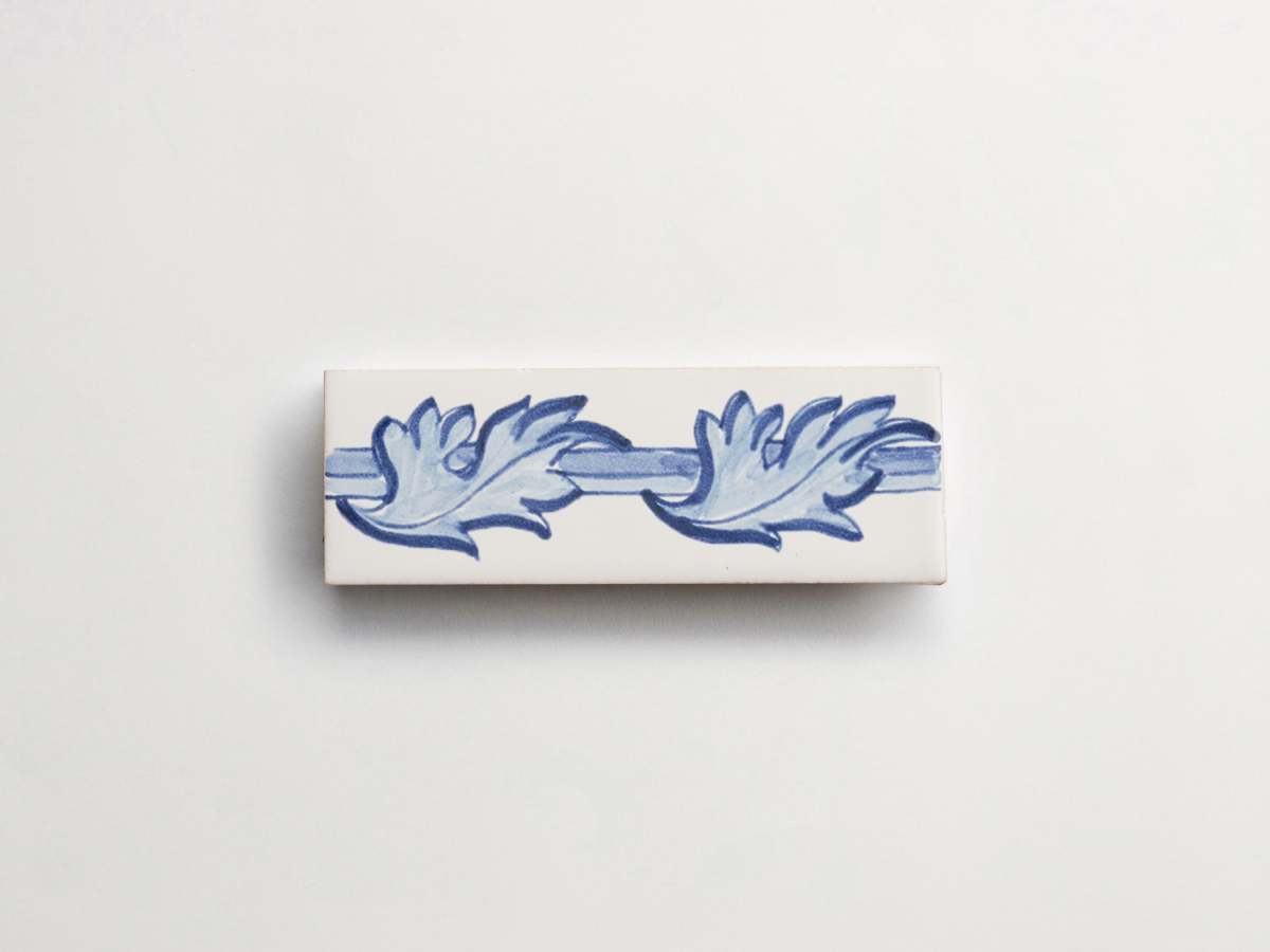 Painted blue white tile delft majolica rectangle backsplash.