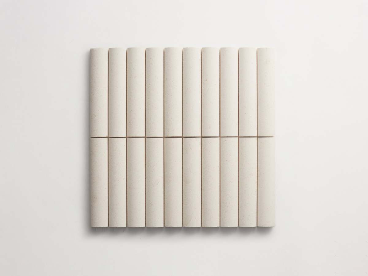 Rounded white 3d-tile limestone cabochon short.