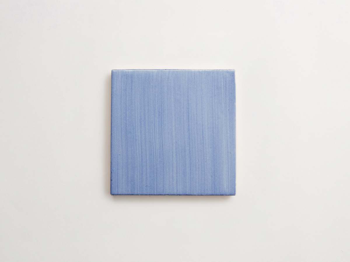Painted medium blue majolica square ceramic delft.