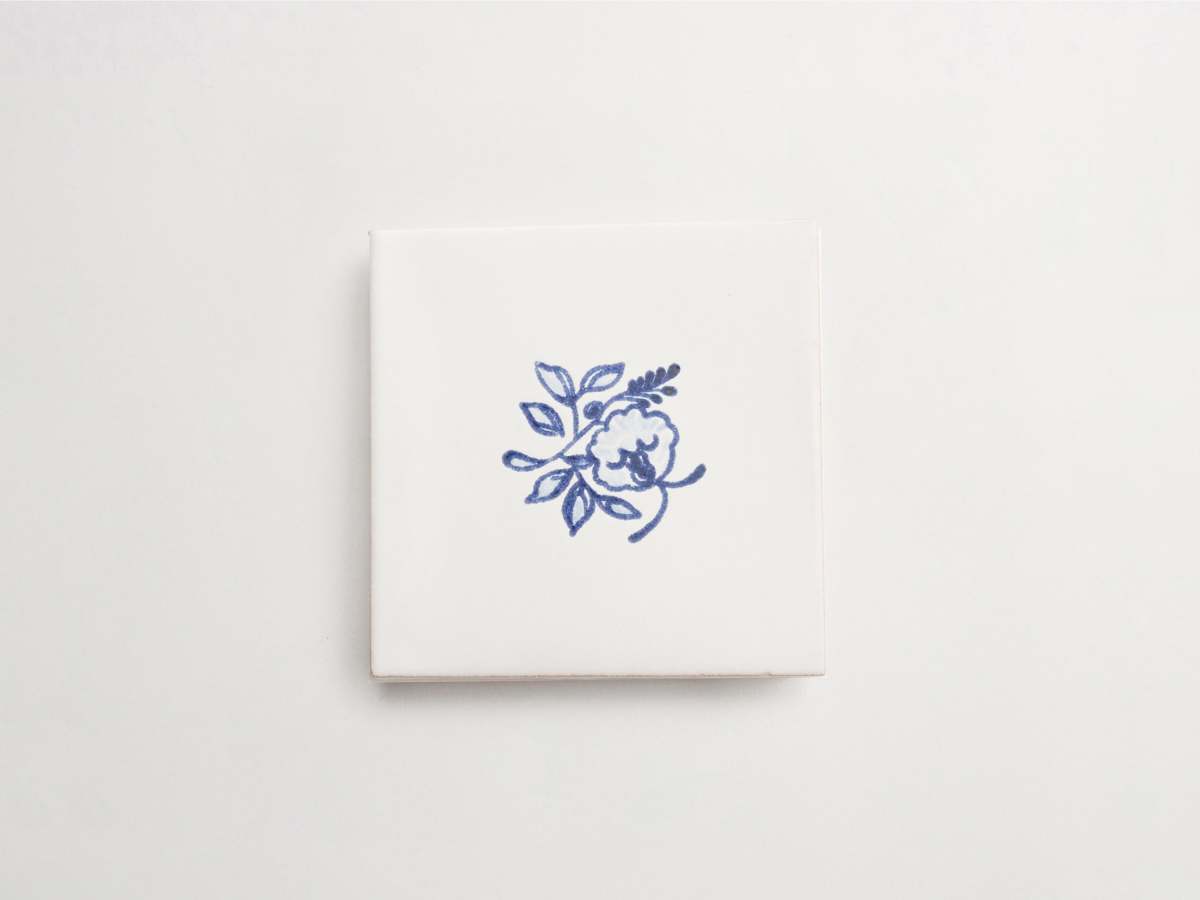Square blue and white painted tile backsplash majolica delft.