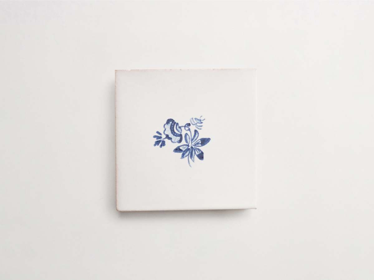 Painted square tile blue flowers backsplash majolica delft.