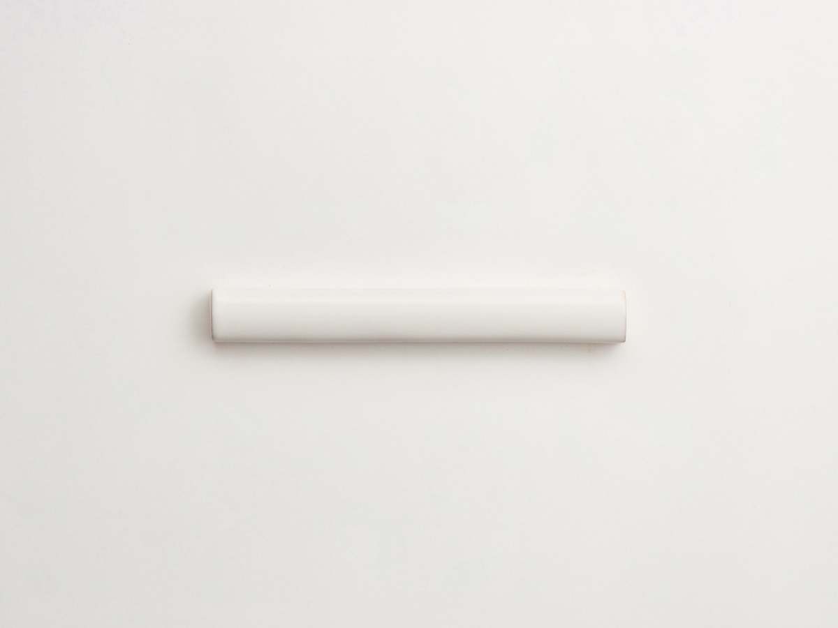 White ceramic backsplash delft pencil tile majolica.