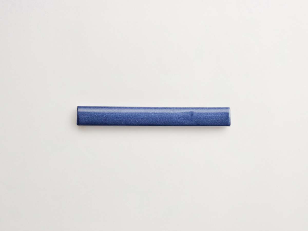 Dark blue pencil tile painted majolica de delft ceramic.