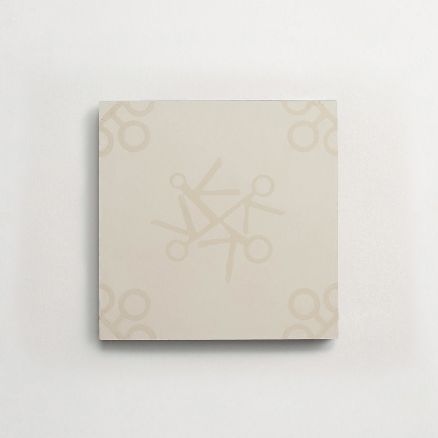 A square ceramic tile with a subtle beige pattern of scissors arranged in a circular design on a plain white background.