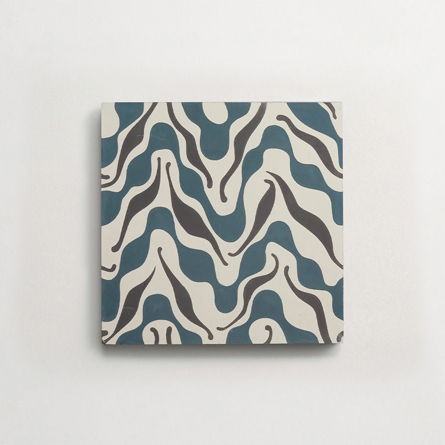Square ceramic tile with an abstract, wavy pattern in teal blue, black, and white on a plain white background.
