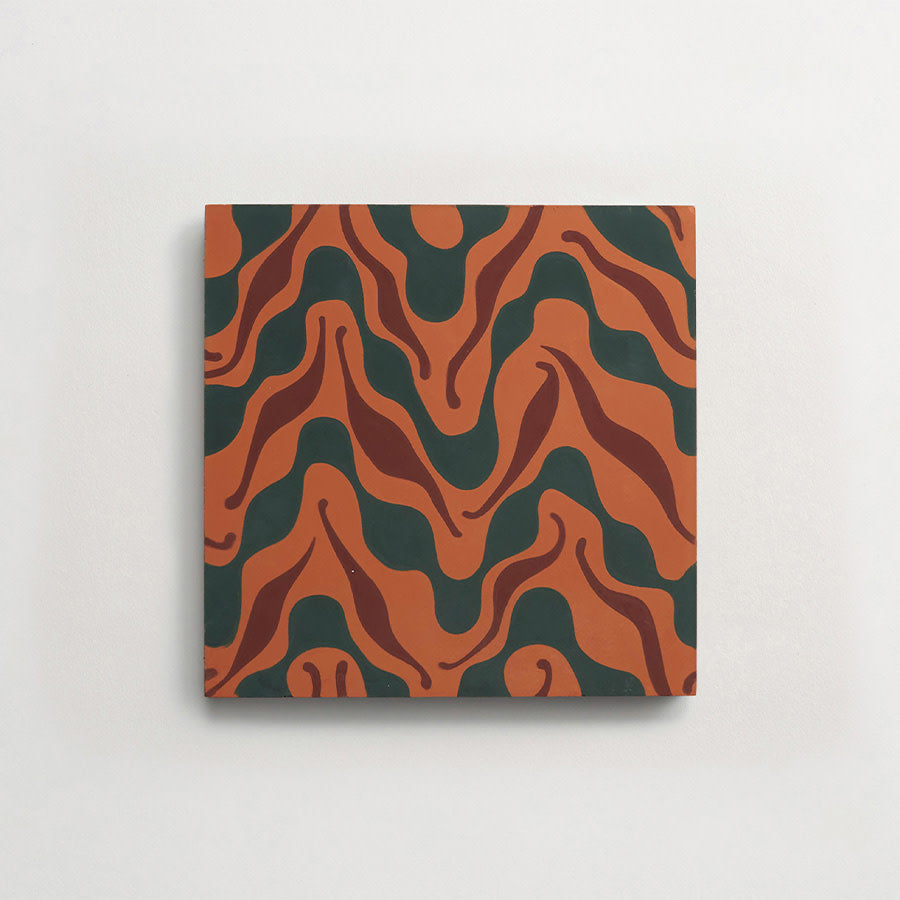 A square tile with an abstract wavy pattern in dark green, reddish-brown, and orange tones on a light background.