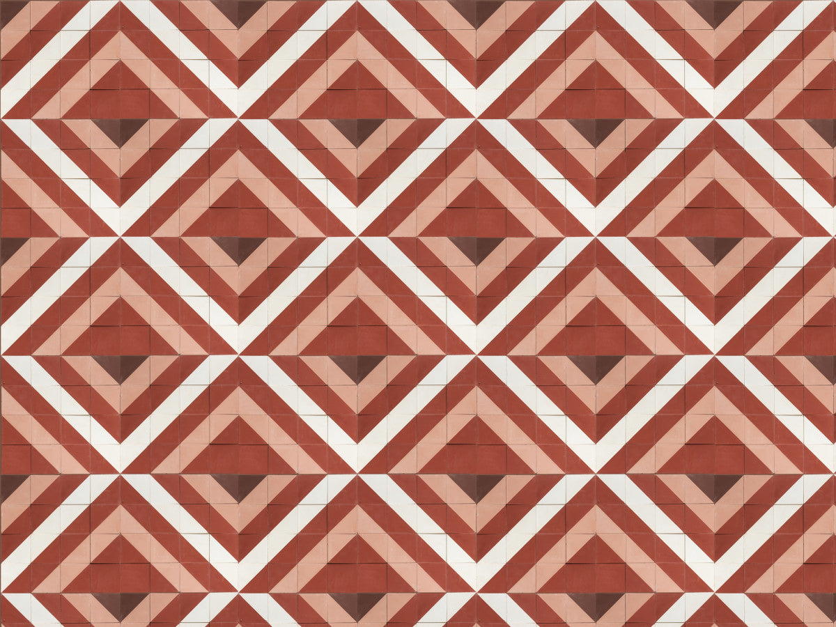 A repeating geometric pattern of red, pink, and white triangles and diamonds forming zigzag shapes across a tiled surface.
