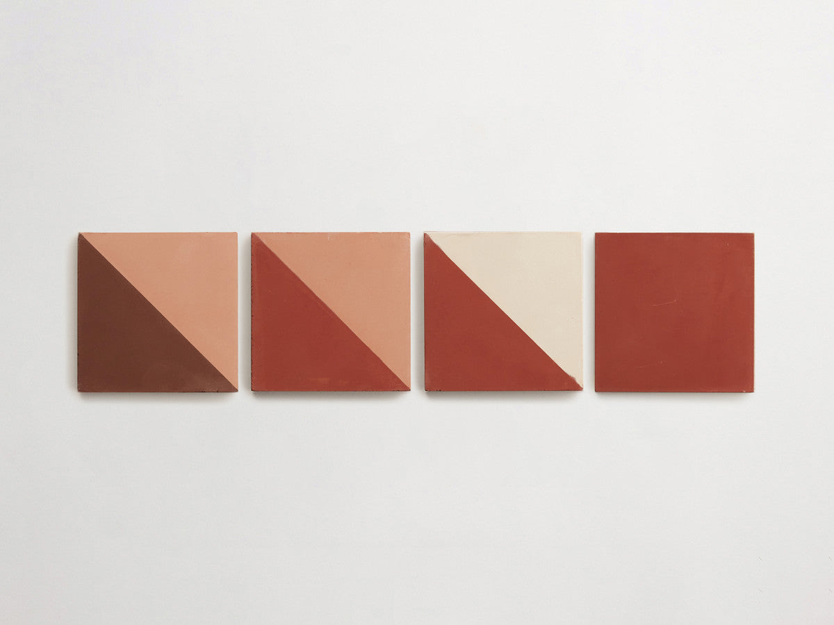 Four square tiles in a row, each divided diagonally into two color blocks with varying shades of brown, beige, and red, set against a plain white background.