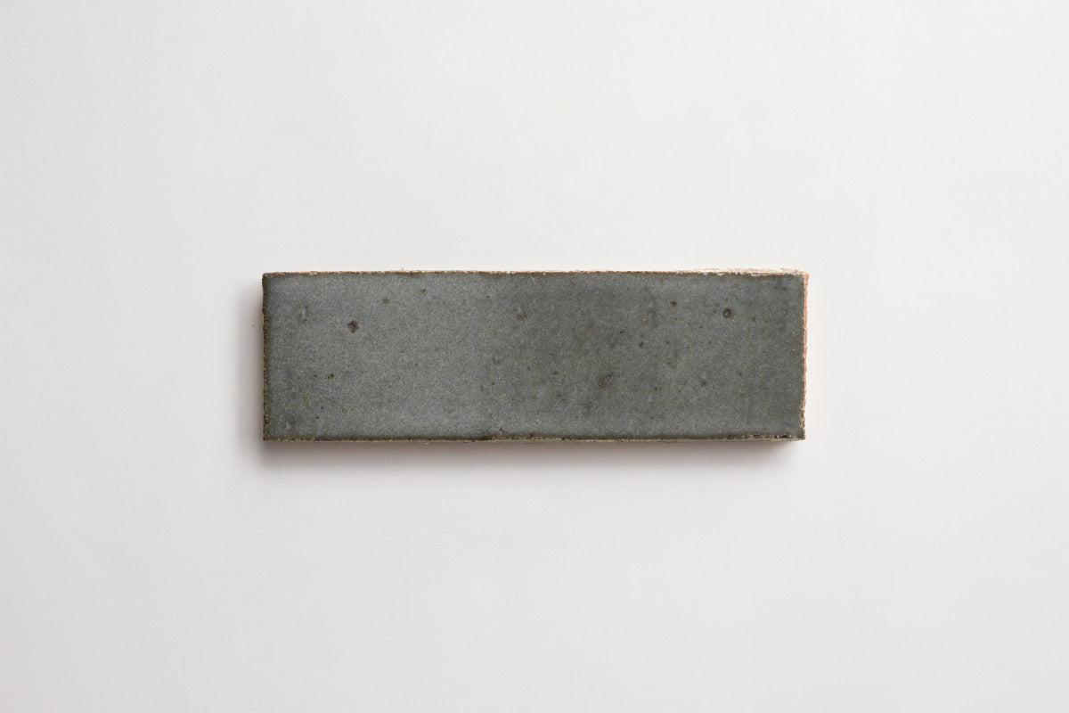 clé guild | thin glazed brick | black wool | 8 x 2.5 x 0.5