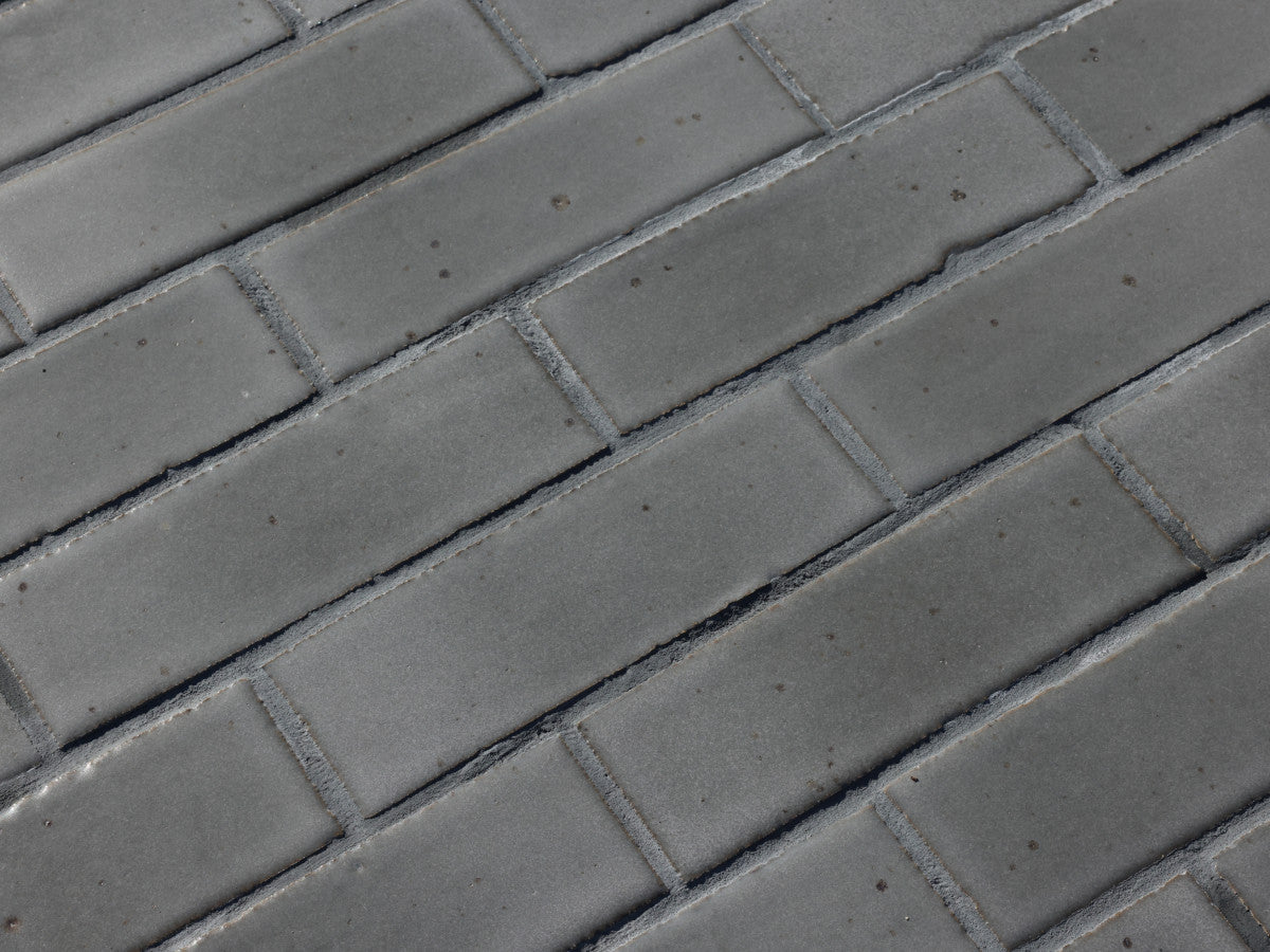clé guild | thin glazed brick | black wool | 8 x 2.5 x 0.5