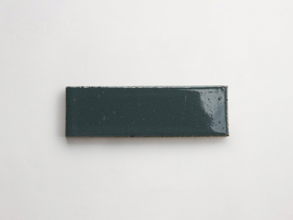 Glazed thin brick 2½x8 Cold Spring Blue guild.