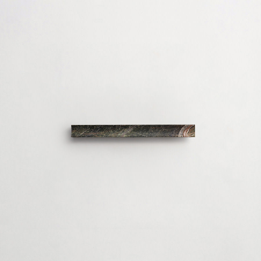 A single, dark, rectangular object is centered on a plain white background.