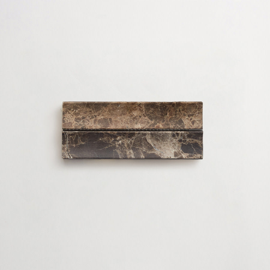 Rectangular piece of dark brown marble with natural veining, mounted horizontally against a plain white background.