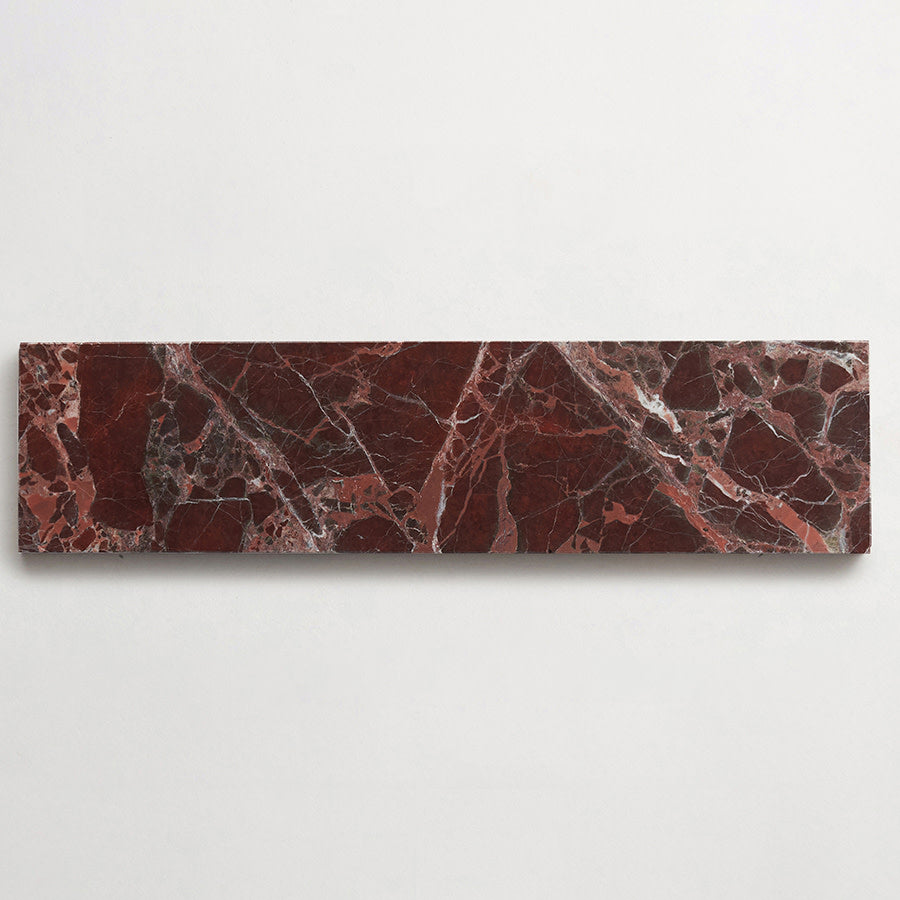 A rectangular slab of dark red marble with white and gray veining, displayed against a plain white background.