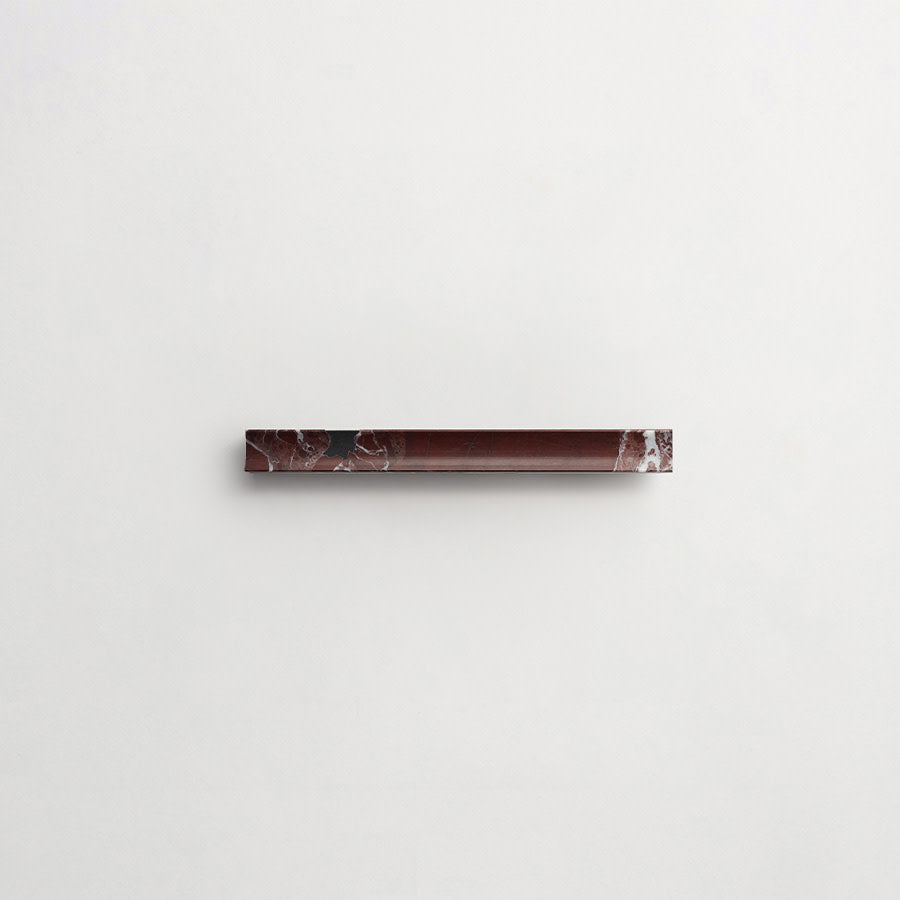 A horizontal, rectangular strip of dark brown marble with white veining mounted on a plain white background.