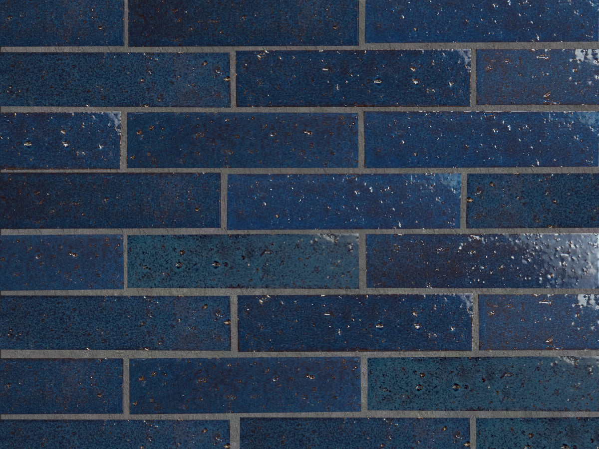 Modern farmhouse glazed brick brindled blue gloss tile.