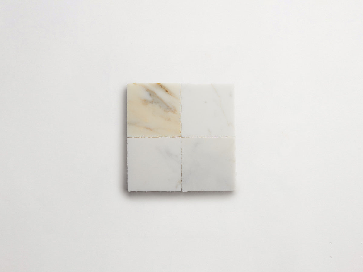 Lapidary stone tile 4 in. square Calacatta Gold Honed.