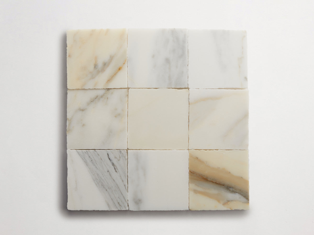 Lapidary stone tile 4 in. square Calacatta Gold Honed.