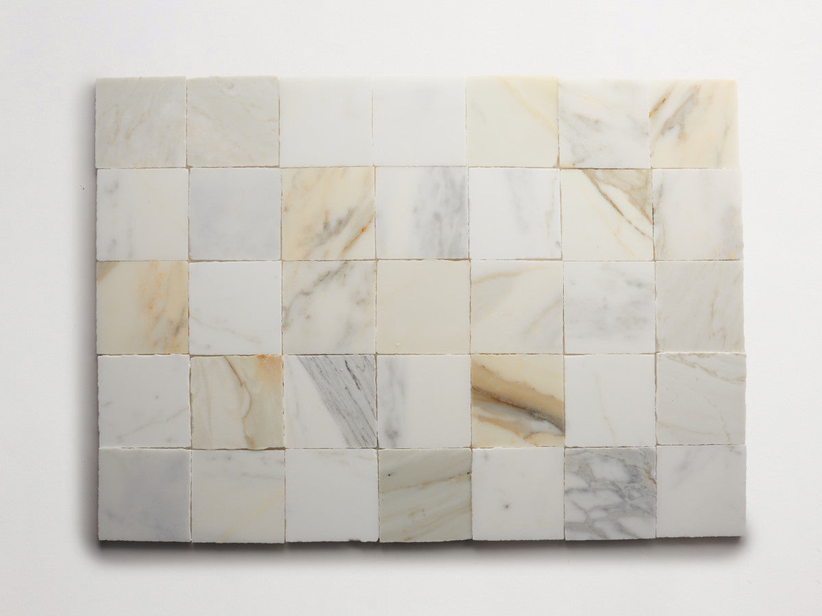 Lapidary stone tile 4 in. square Calacatta Gold Honed.