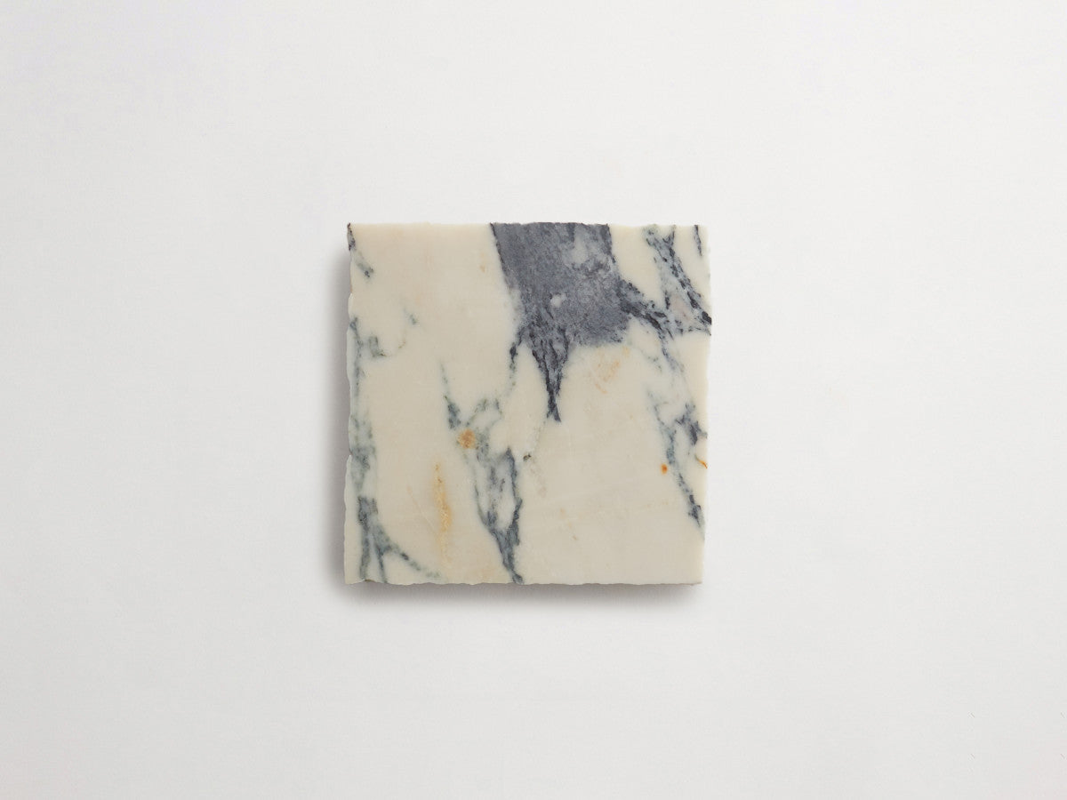 Lapidary stone tile 4 in. square Calacatta White Honed.