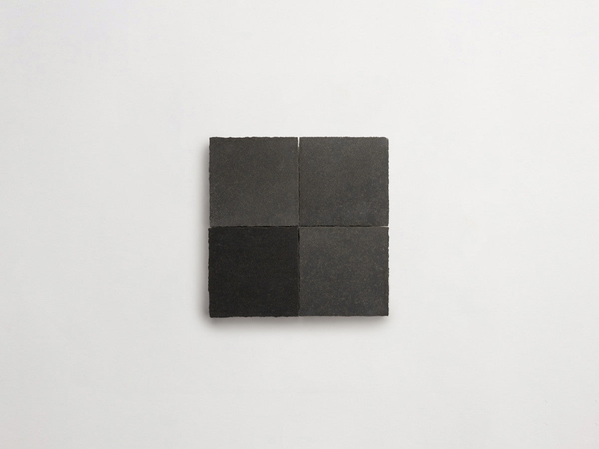 Lapidary stone tile 4 in. square Warm Black Honed.