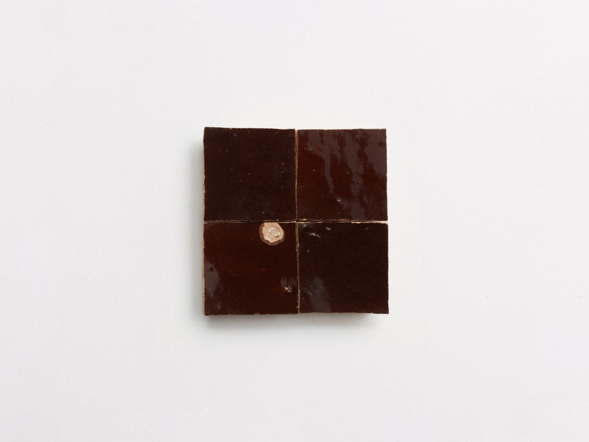 Zellige tile brown glaze argan brown 2" square.