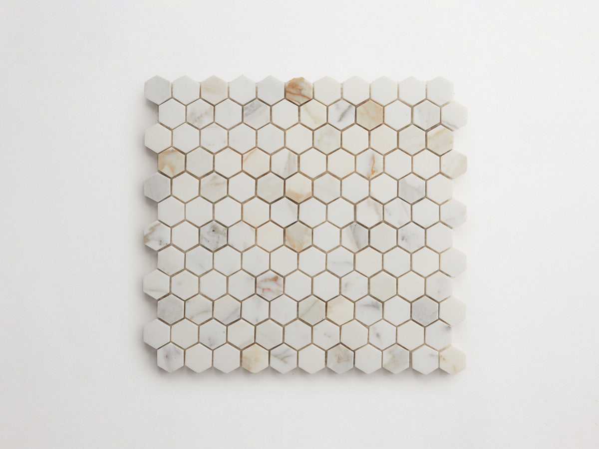 Premier Stone Tile honed white gold marble hex 1 x 1⅛.