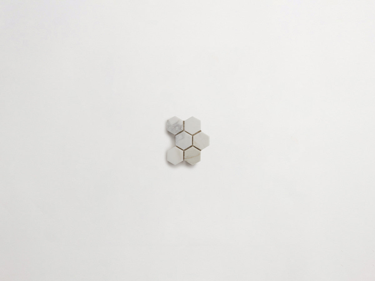 Premier Stone Tile honed white gold marble hex 1 x 1⅛.
