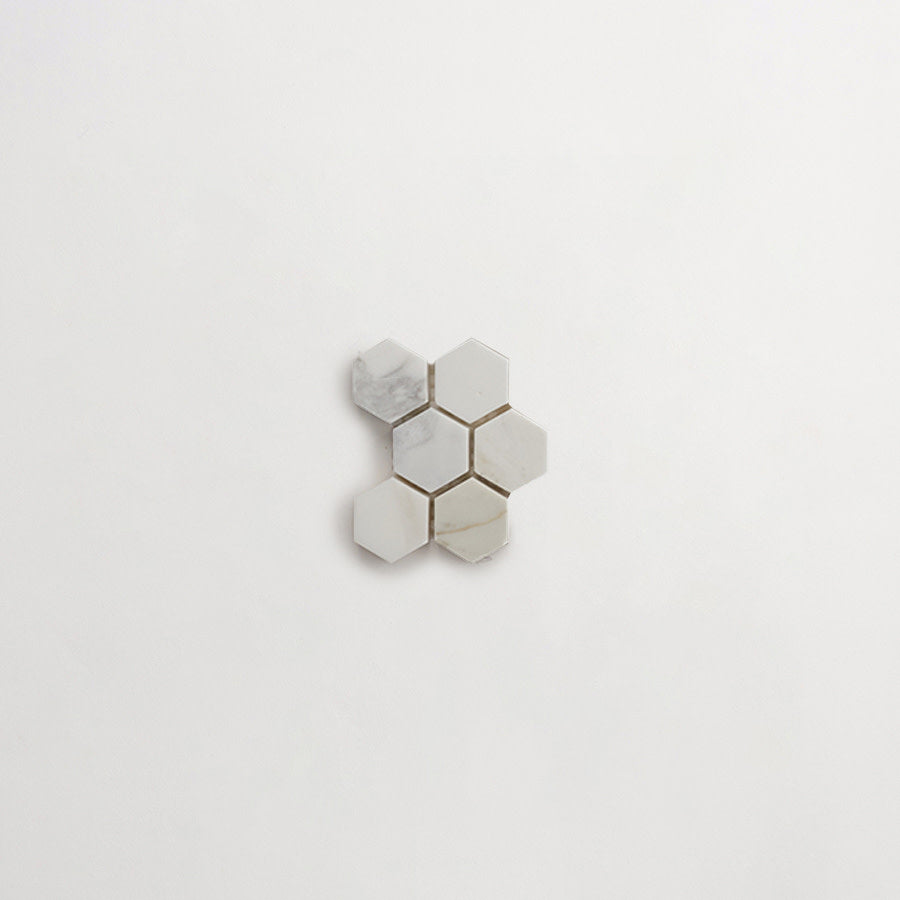 Six white hexagonal tiles arranged in a honeycomb pattern on a plain white background.