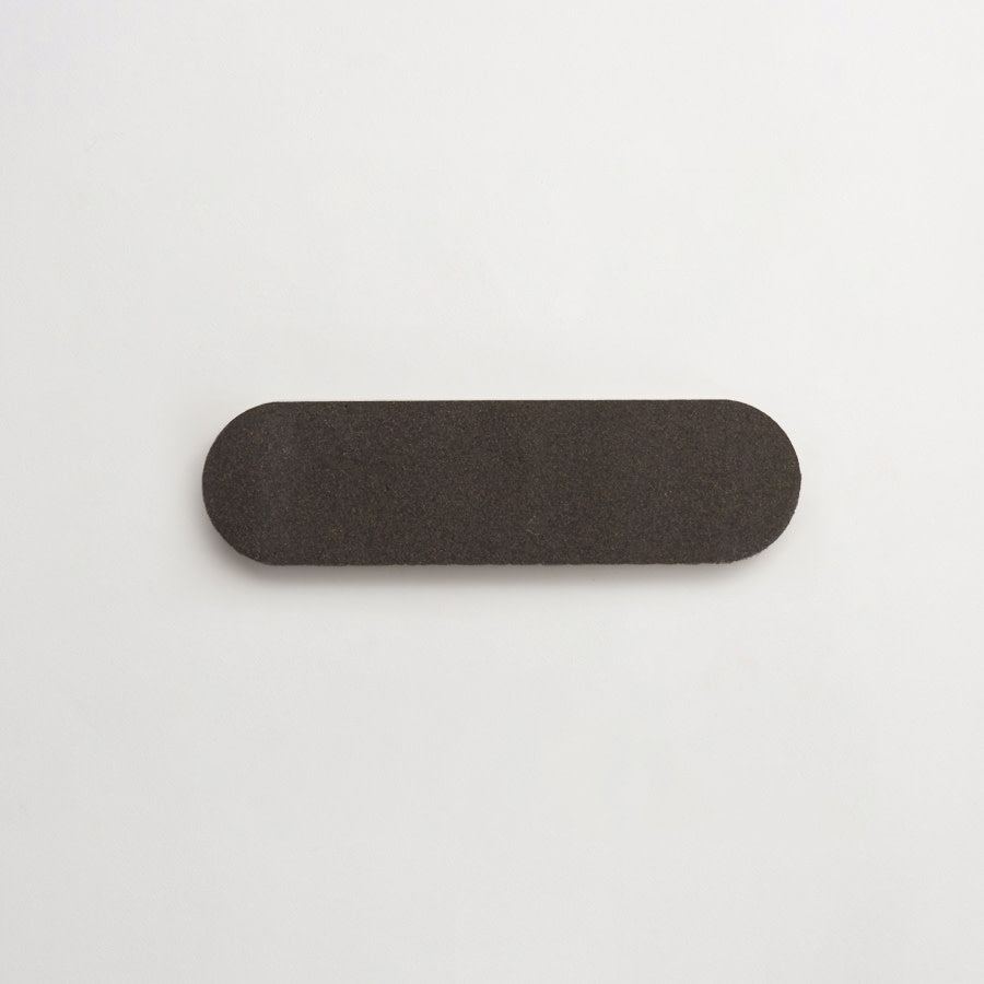 Lapidary oval tile warm black 8.5 x 2.375.