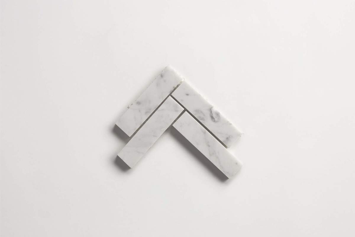 Tile carrara marble white stone herringbone mosaic.