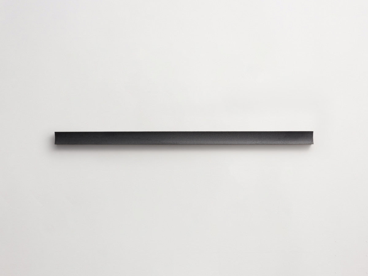 Lapidary fluted tile warm black 23.5 x 1.25.