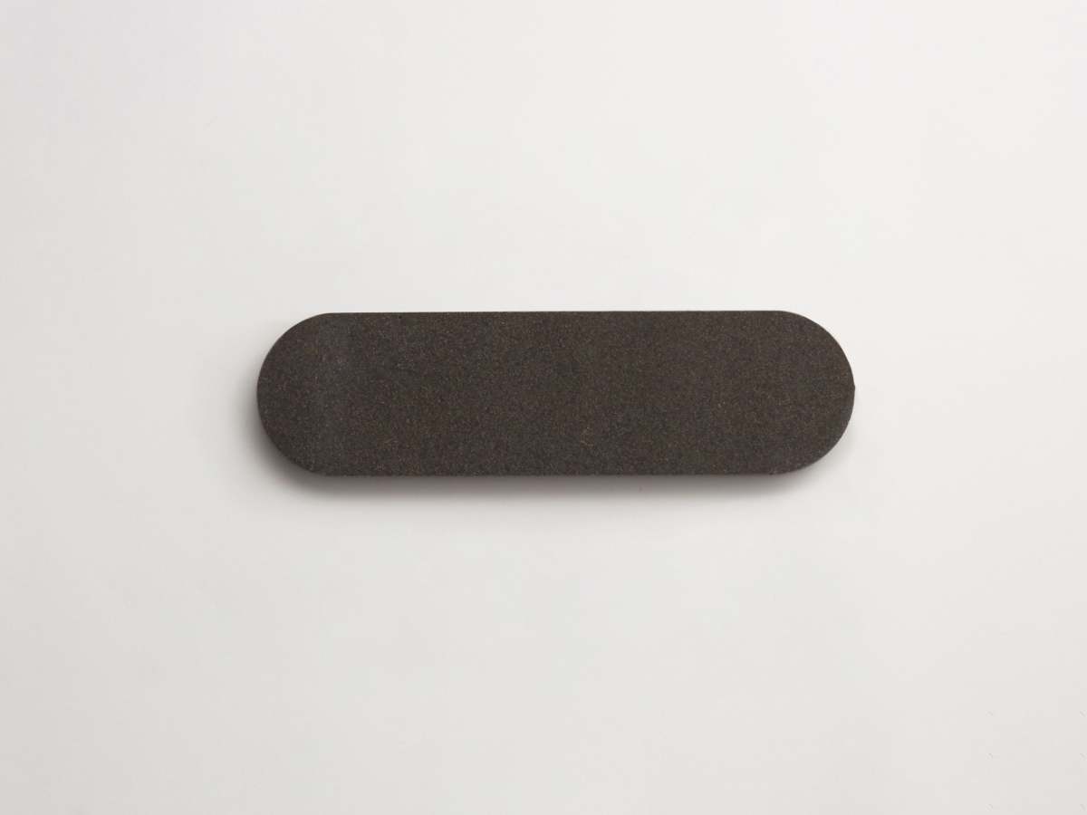Lapidary oval tile warm black 8.5 x 2.375.