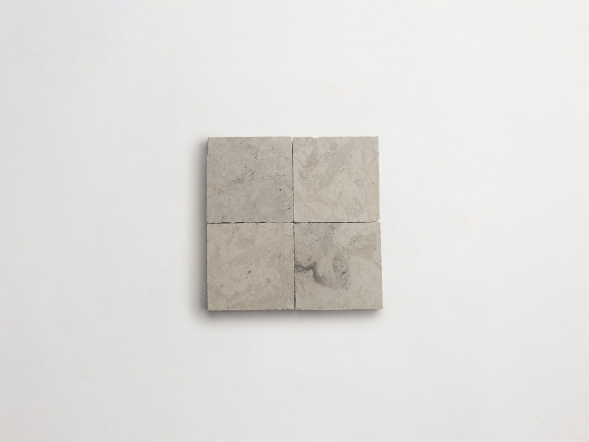 Lapidary stone tile 4 in. square Alpaca Grey Honed.