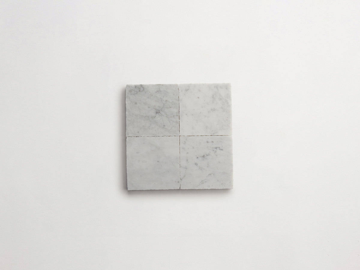 Lapidary stone tile 4 in. square Carrara White Honed.