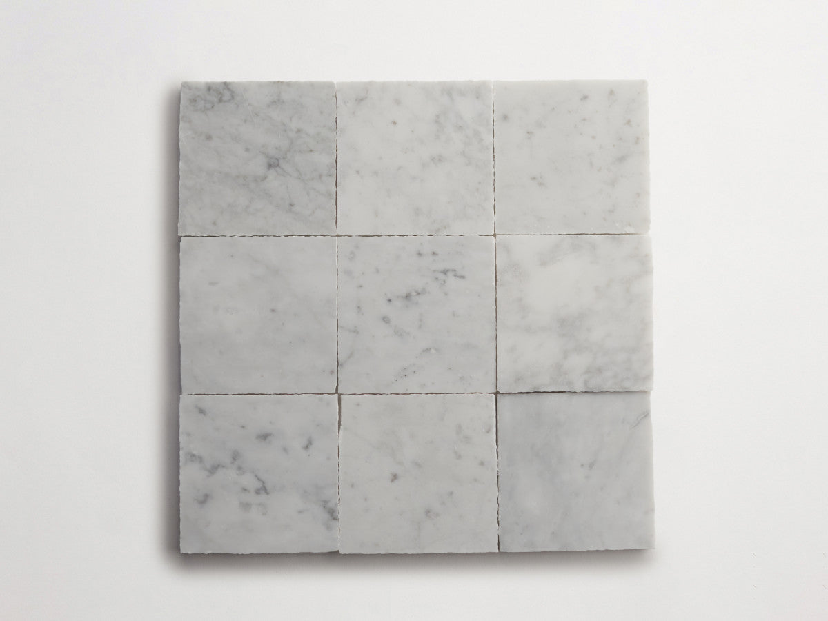 Lapidary stone tile 4 in. square Carrara White Honed.