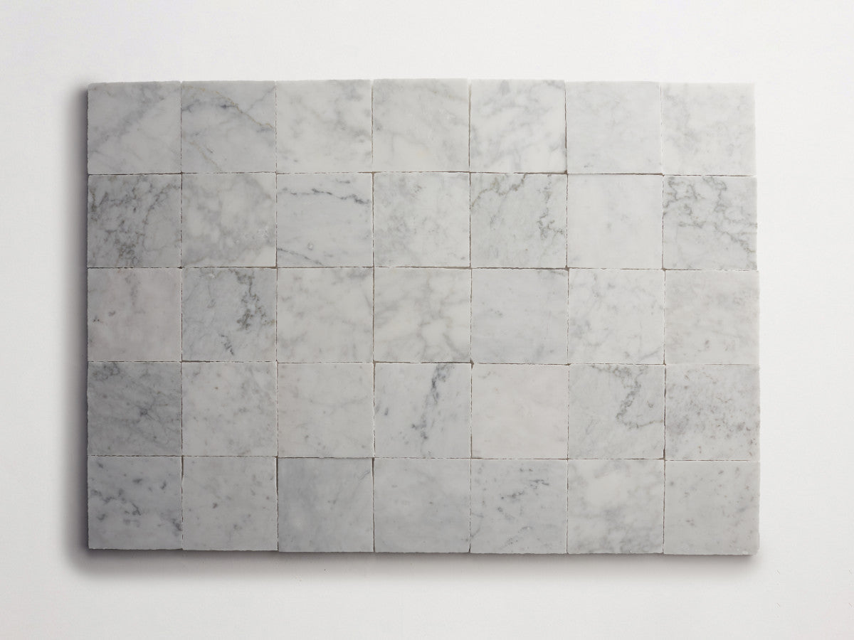 Lapidary stone tile 4 in. square Carrara White Honed.