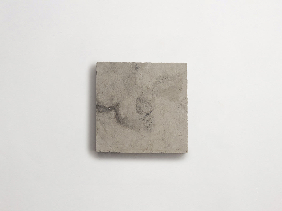 Lapidary stone tile 4 in. square Alpaca Grey Honed.