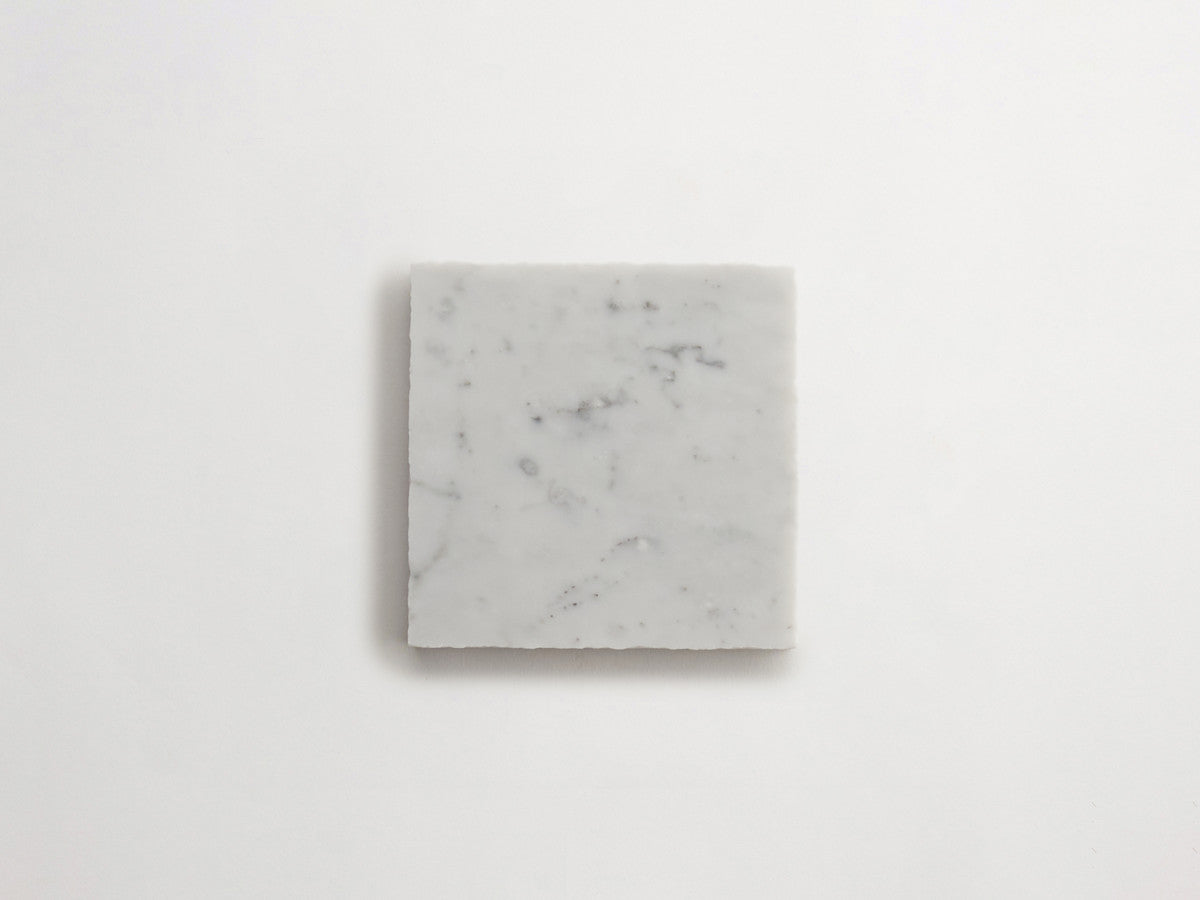 Lapidary stone tile 4 in. square Carrara White Honed.
