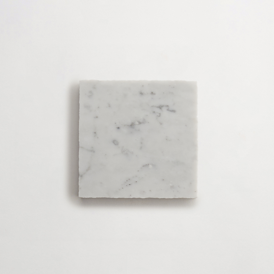 Lapidary stone tile 4 in. square Carrara White Honed.