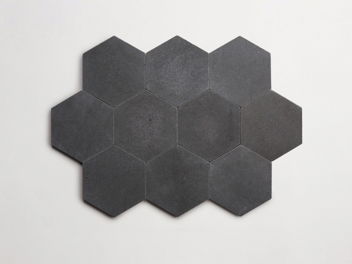 Lapidary stone tile 6¾ in. hex Warm Black Brown Tumbled.