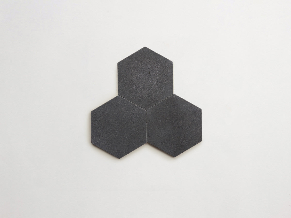Lapidary stone tile 6¾ in. hex Warm Black Brown Tumbled.