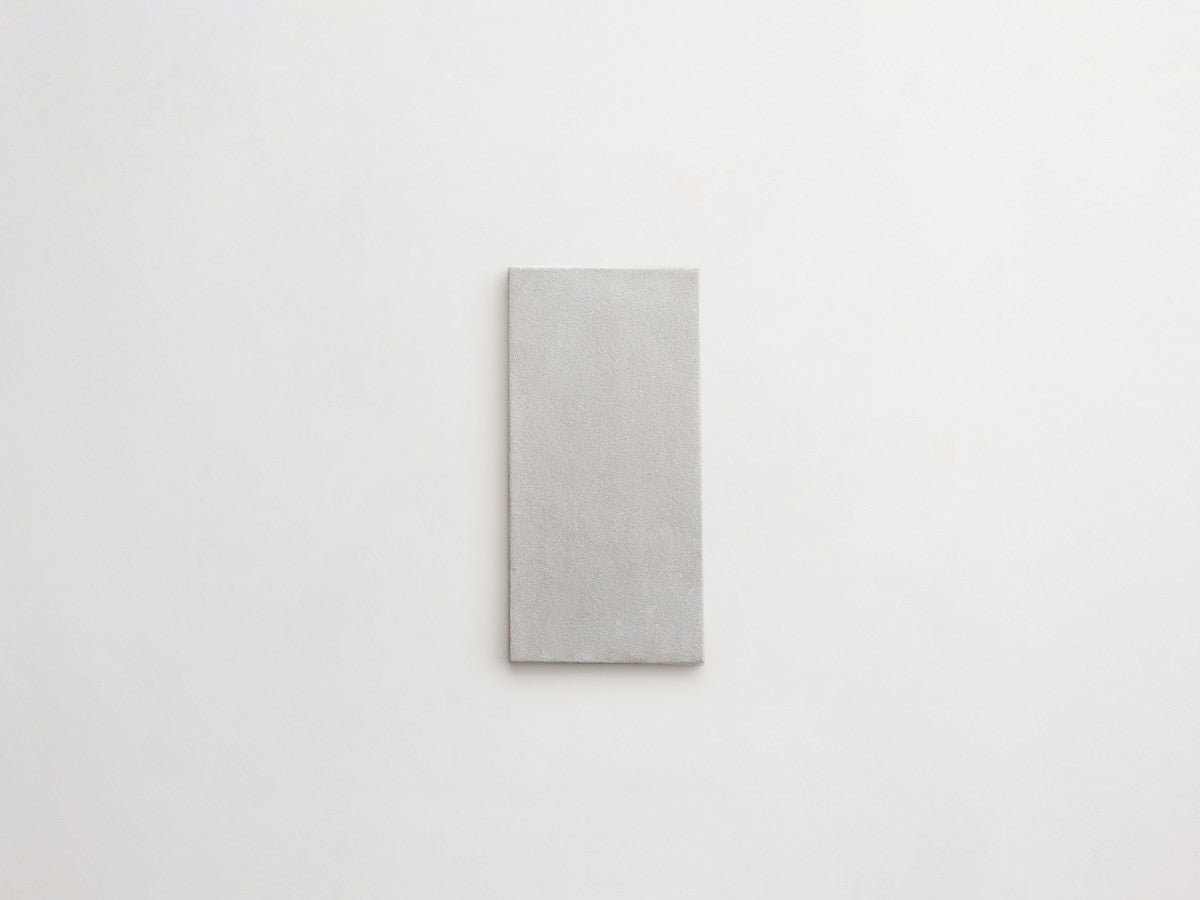 Ceramic Shibori Tile White 8x4 Grey Stain tile.